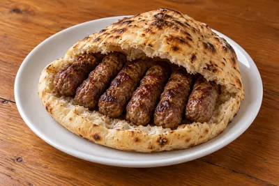 Ćevapi — AI ilustracija jela iz jelovnika Ručkić